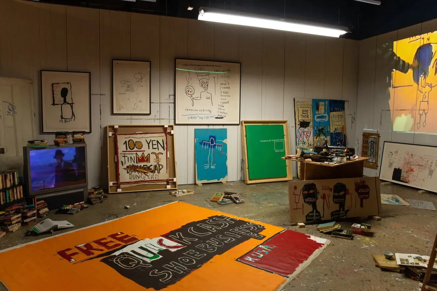 Basquiat studio recreation at King Pleasure exhibition, with paintings, sketches and video content by FRAY Studio.